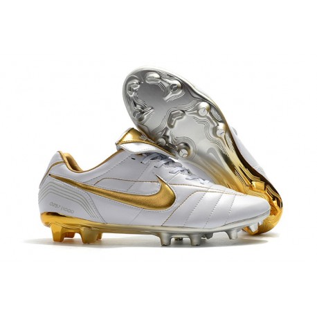 white and gold nike boots